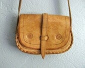 vintage SMALL tan LEATHER cross-body TOOLED purse.