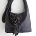 purple leather handbag, messenger with detachable flower and leaf fringe, by Tuscada. Made to order.