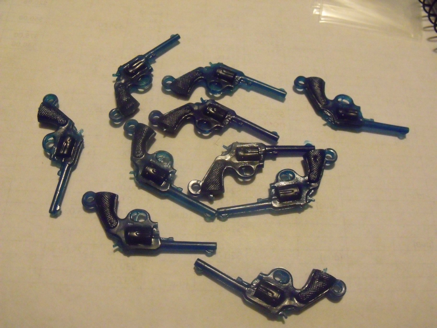 Destash of dark blue plastic gun charms