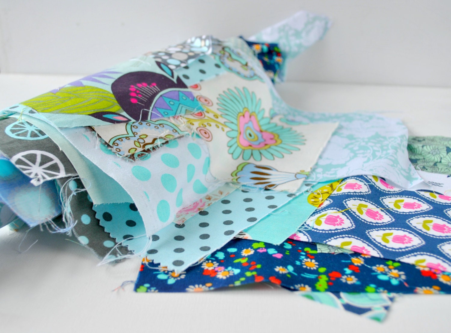 Quilting cotton fabric designer scrap roll Blue tones.