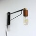 Otis light: 24" black with swiveling Teak socket