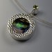 Contemporary circular pendant with peridot gemstone
