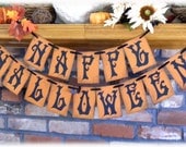 Spooky HAPPY HALLOWEEN holiday banner in rustic orange and black with spider webs and 3D bats