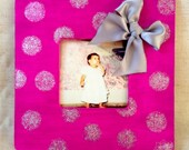 pink with silver polka dots and ribbon frame