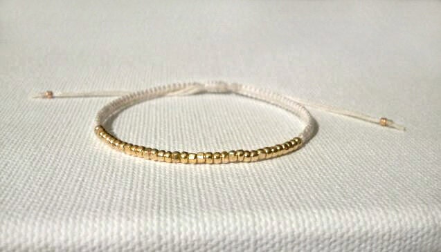 tiny faceted gold nugget beaded micro macrame friendship bracelet. shyly.