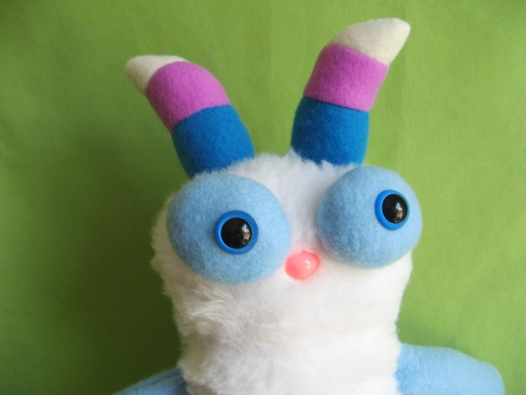 Monster toy stuffed animal plush with striped horns