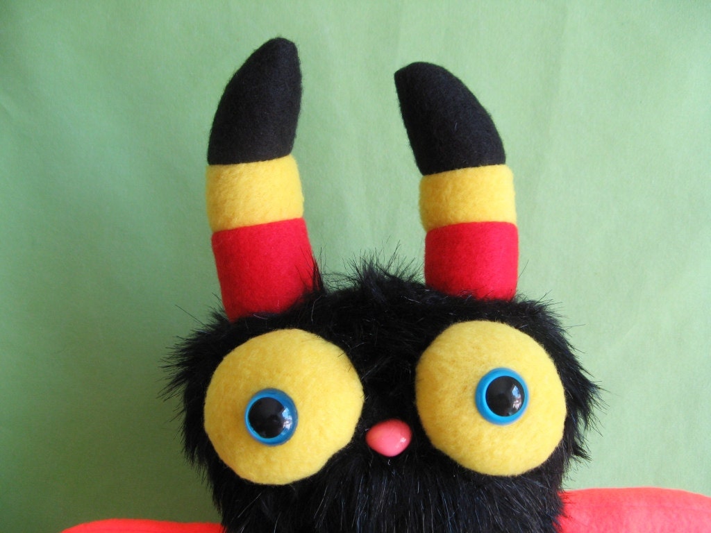 Monster toy stuffed animal plush with striped horns