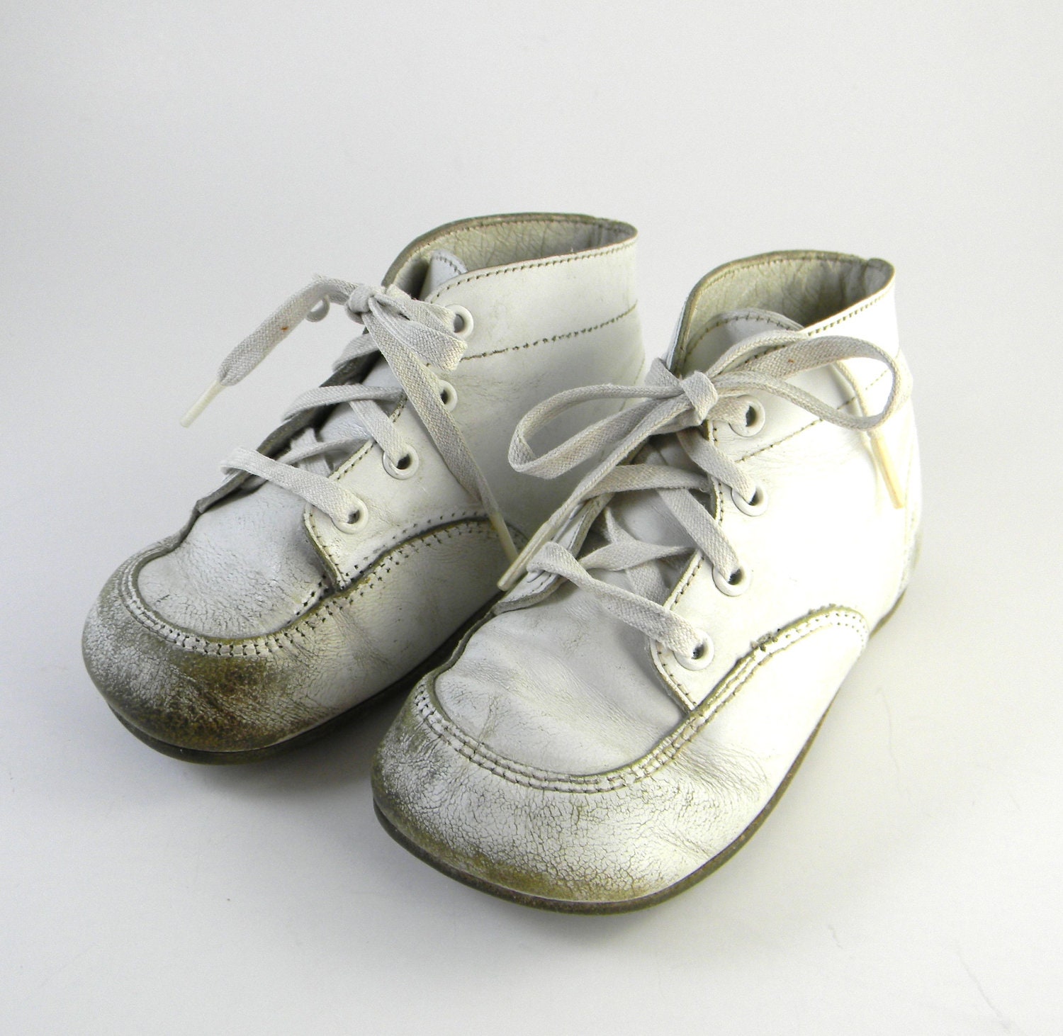 Vintage leather baby booties, baby boots or shoes, lace ups circa 1950 - 1960