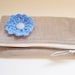 Toiletries bag, square zipper pouch, grey corduroy with blue crochet flower embellishment