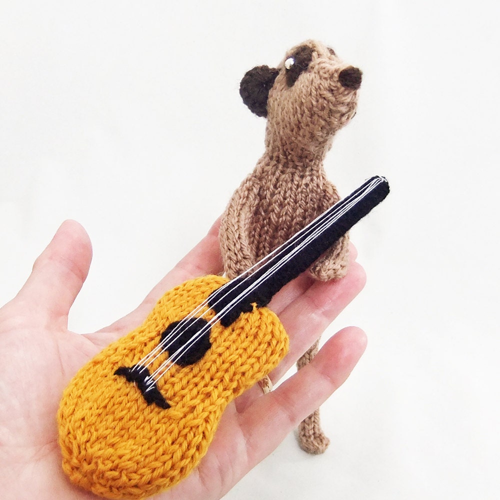 Meerkat with knitted acoustic guitar, guitarist meerkat, meercat guitarist, meerkat musician