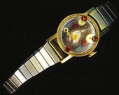 Steam punk Mobe Pearl Bracelet . Upcycled / Recycled Stretchy Watch Band. Adjustable . Red Rhinestones - Steampunk by enchantedbeas on Etsy