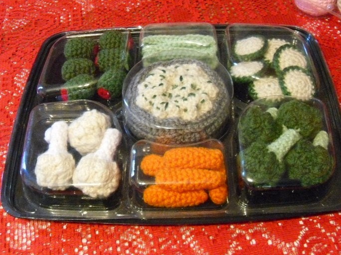 Crocheted veggie tray six cupcakes a fruit salad and 6 eggs