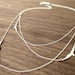 Three Layered Flying Birds Necklace in Silver