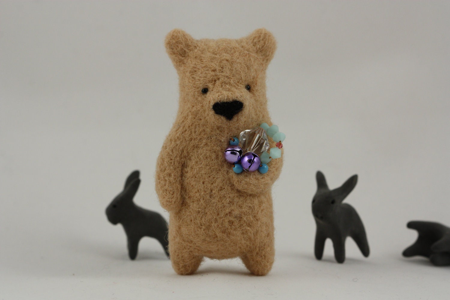 A sandy beige bear brooch