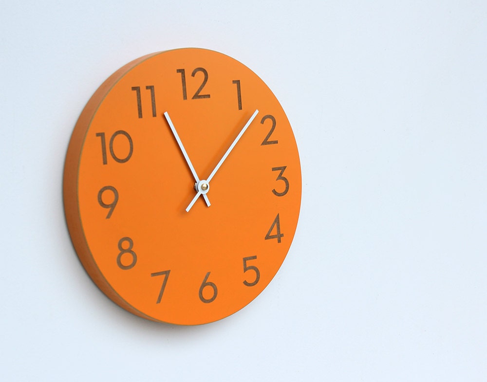 orange spice wall clock with modern numbers