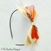 PETIT BOW - Ivory Peacock Mini Feather Bow Headband with Orange and Red Accent Feathers
