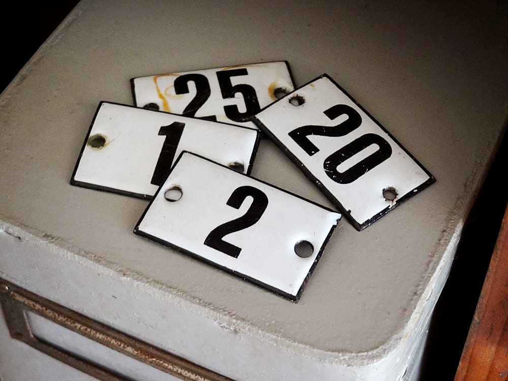 vintage enamel number 25 from Germany, likely used for hotel or apartments, black on white