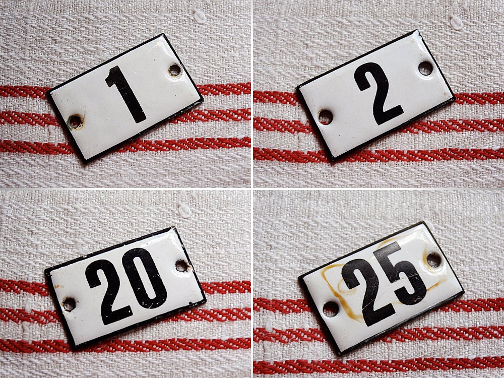 vintage enamel number 25 from Germany, likely used for hotel or apartments, black on white