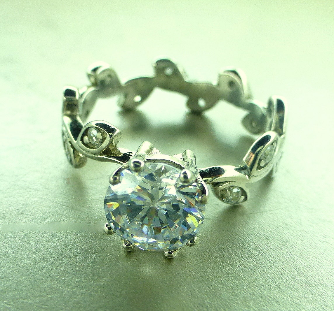 Leaf engagement ring. Moissanite center stone.