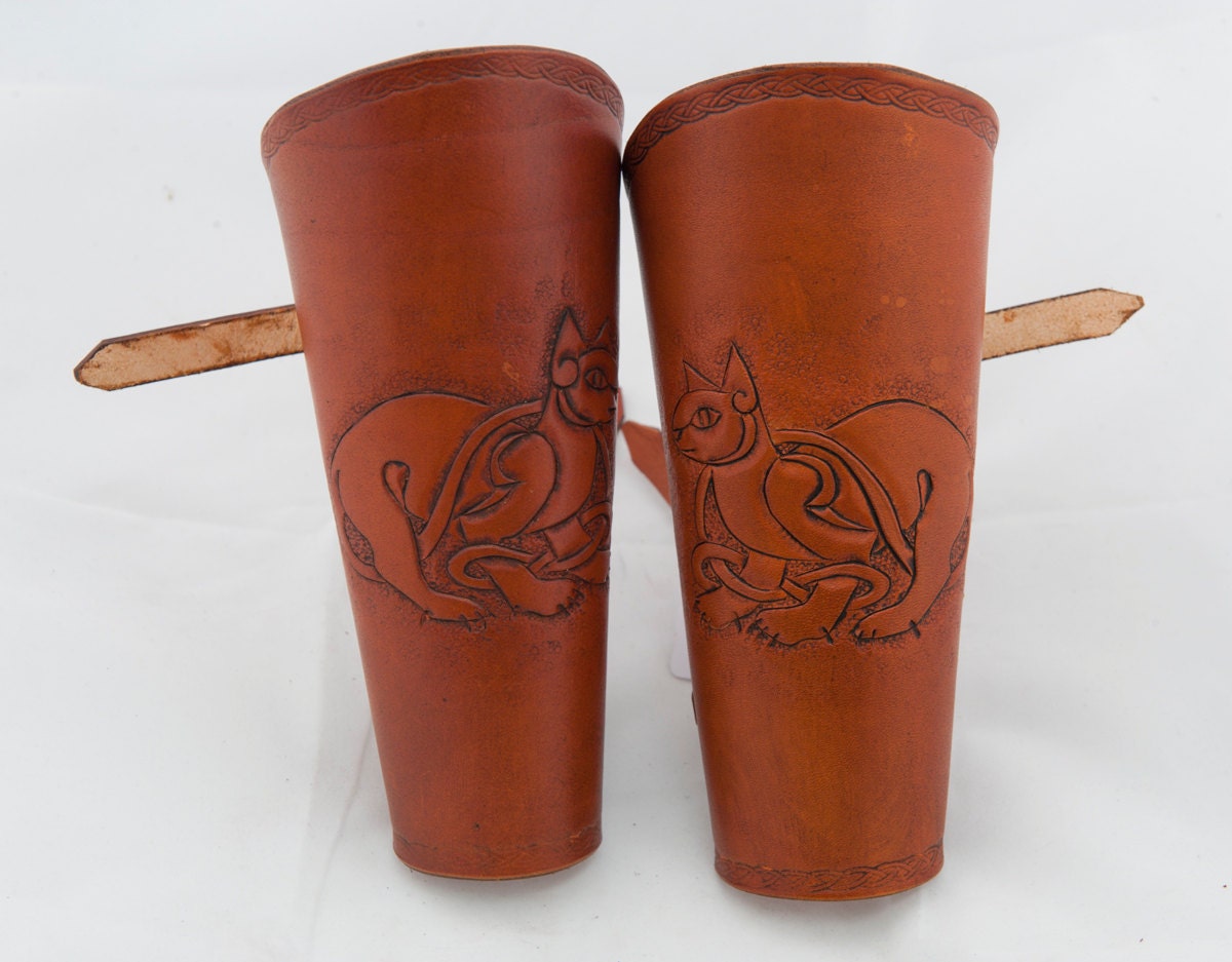 Brown british tan leather bracers with an embossed celtic cat armor cuff armour