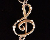 Treble Clef G Clef mixed metal pendant necklace from the Alchemic Collection by Laura Beth Love