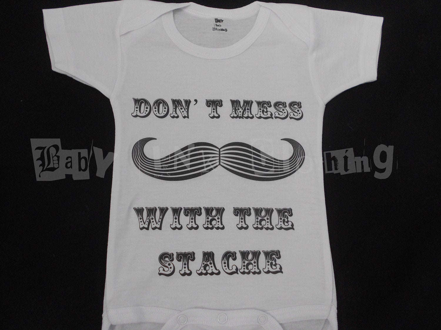 Don't mess with the Stache onesie