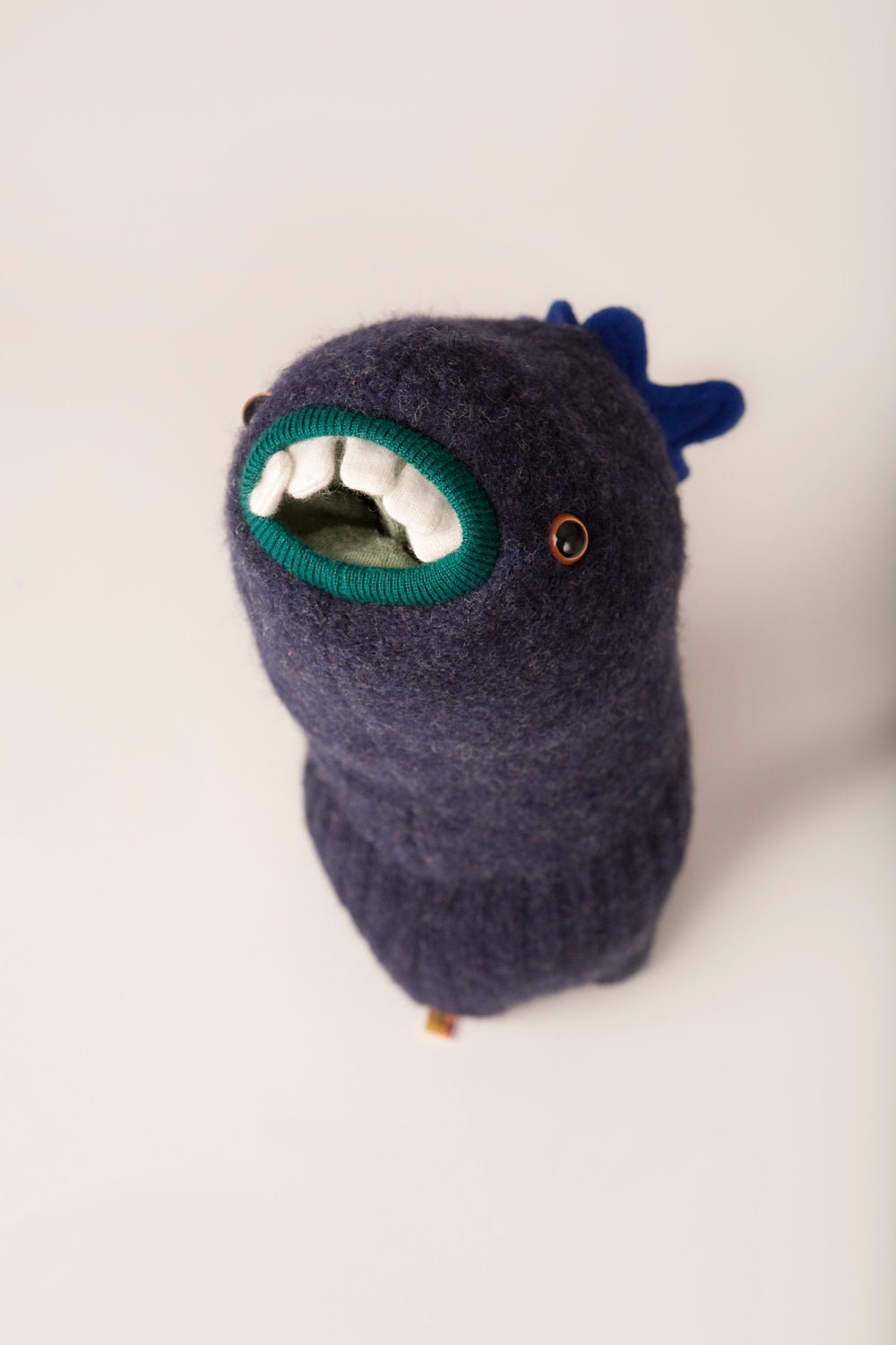 Cooper the monster plushie upcycled from wool sweaters