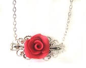 Silver necklace with a red rose cabochon filigree