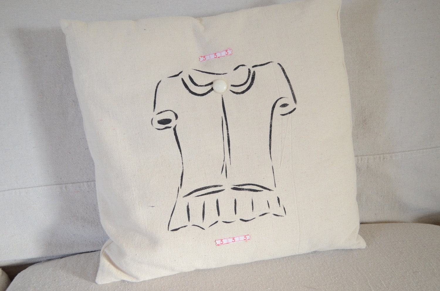 Pillow made from a drop cloth ladies blouse stencil in black paint number 3 ribbon