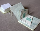 Art book made from vintage geometry textbooks and handmade prints ("Isosceles Romance")