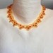 Golden lace beaded chocker with red crystal 