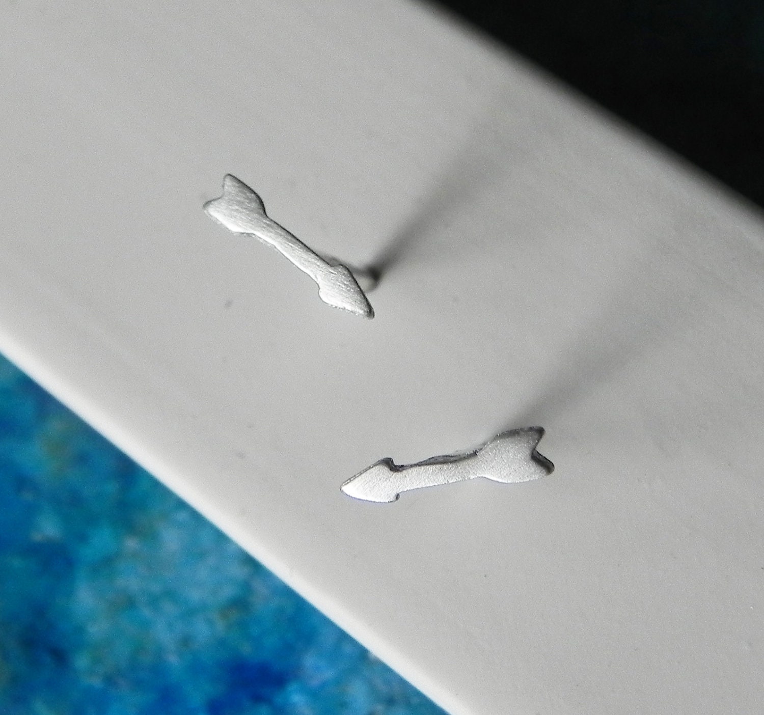 So tiny delicate arrow stud earrings in sterling silver
