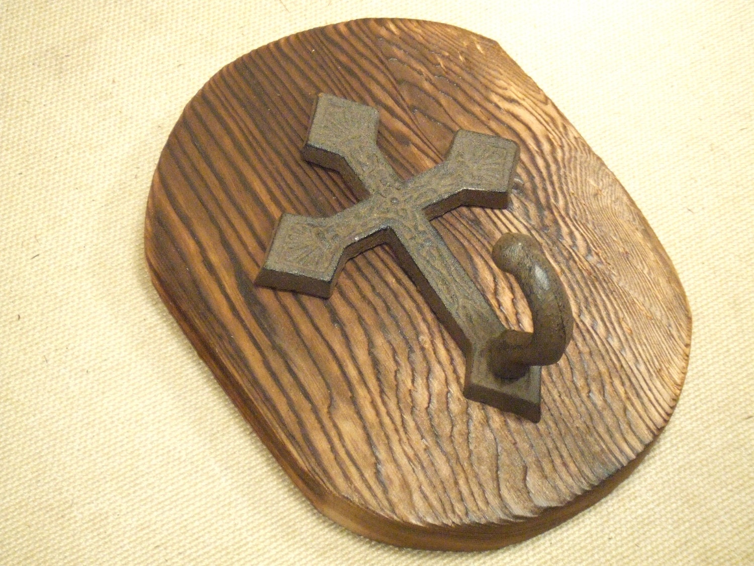 Rustic cross coat rack -- lodge cabin farmhouse decor -- rich patina on cast iron hooks and western cedar