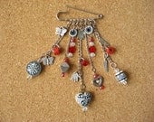 silvertone  brooch ,kilt pin - black & white and red   beads with silvertone charms