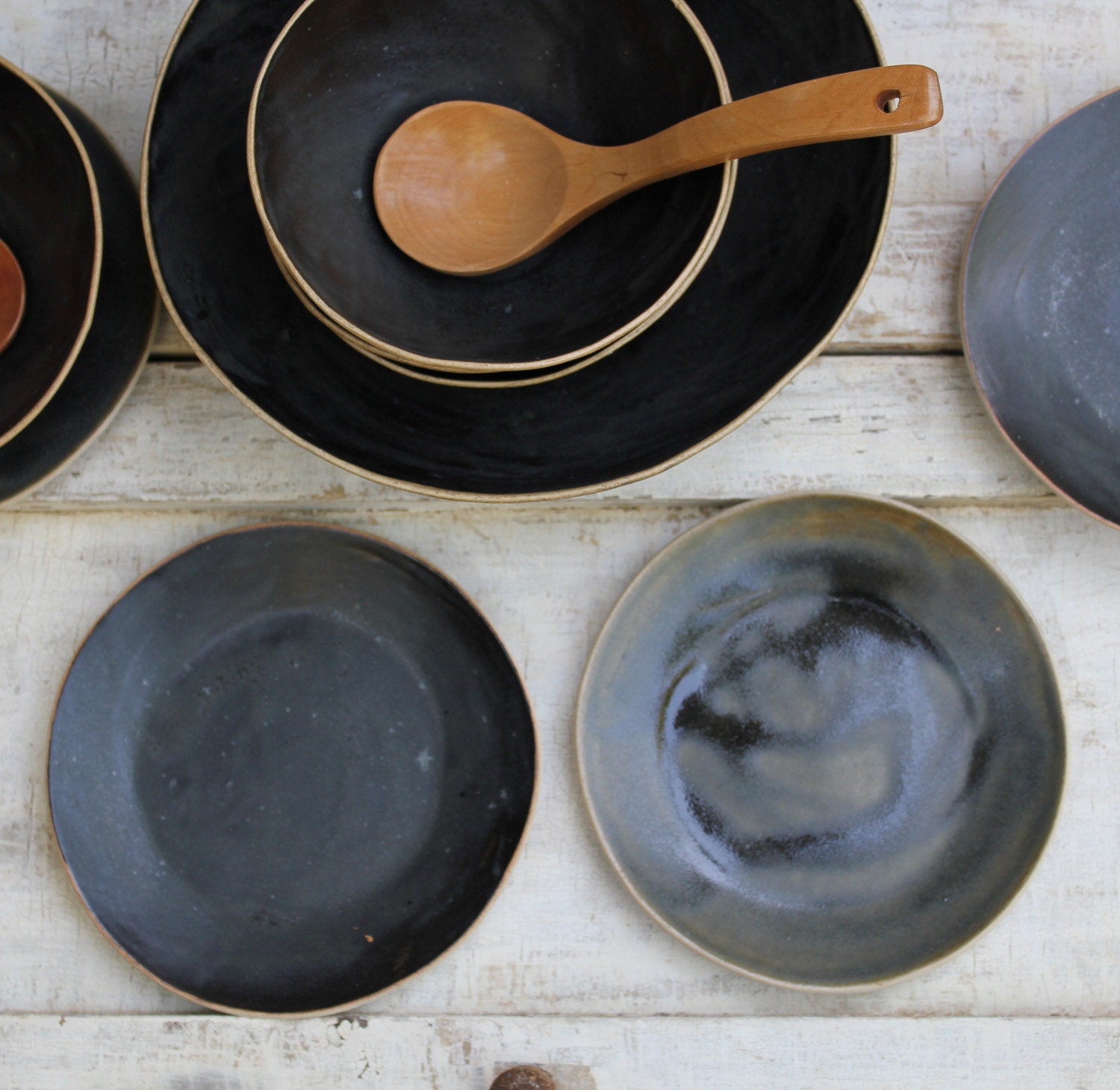 lovely black bowls with plates for soup or salad or cereal...