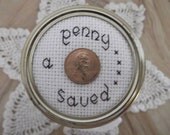 Decorative Mason Kerr Quart Glass Jar Finished Cross Stitch Top "A Penny Saved"