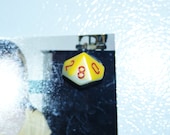 Refrigerator magnet upcycled 10 sided dice.