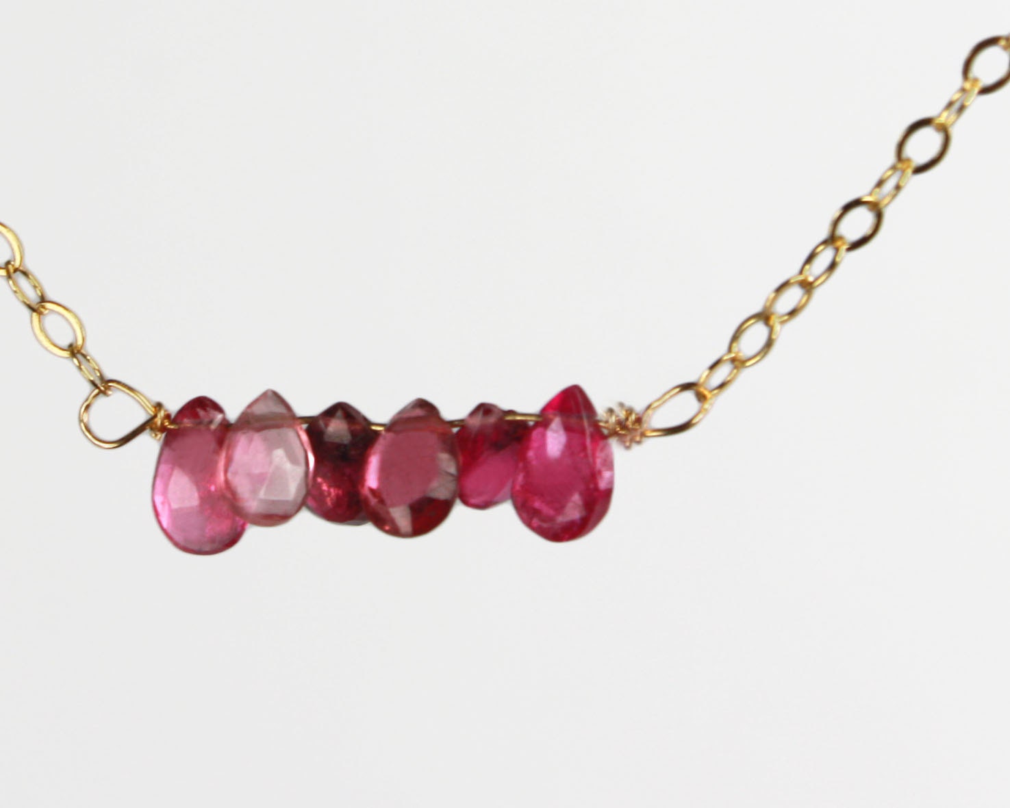 Dangling Karats. Pink tourmaline briolettes tear drops a gold filled chain (NM-240)
