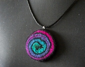 Handfelted pink, purple and green mulberry silk and wool spiral pendant on a black satin cord necklace