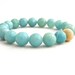 aquamarine bracelet with gold focal bead. sparkle. pretty. stacking bracelet. mint. aqua. feminine