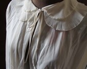 1960's silky cream shrug. Cream. Small or medium.