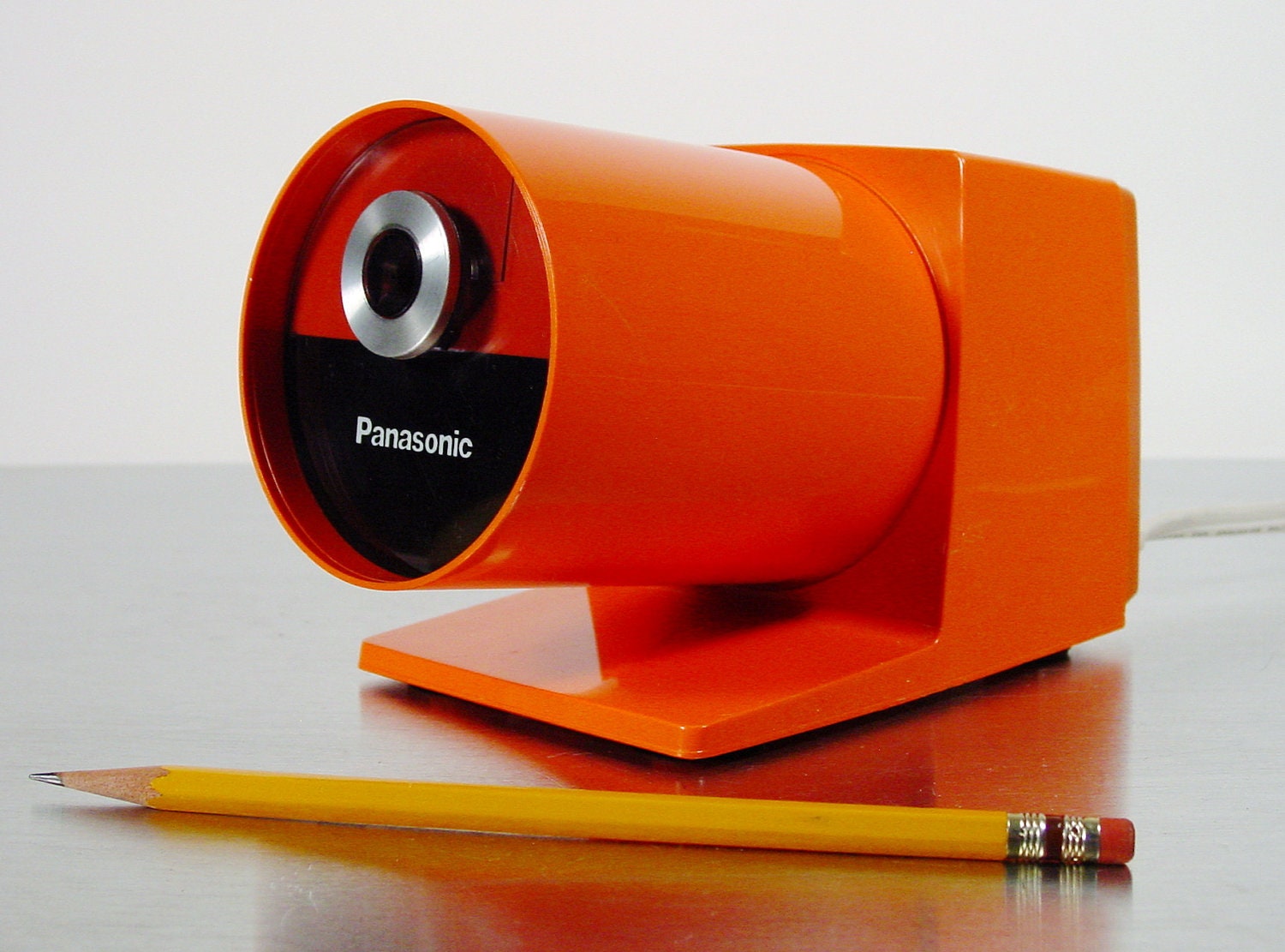 Midcentury Modern Orange Electric Pencil Sharpener by Panasonic, model KP-22A Pana-Point Mod Pop Art Pencil Sharpener, 1970s. - ClubModerne