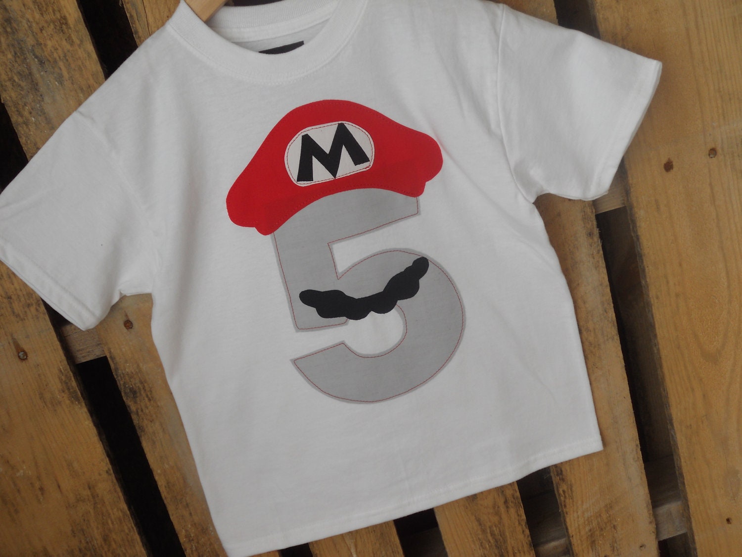 Mario Bros. Birthday shirt with a grey number. Available in any number. Five, Six, etc.