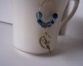 Fairy earrings, handmade, antiqued brass fairy charm, fire polished blue crystals, nature, mother earth, whimsy, fun