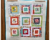 Modern log cabin baby quilt