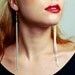 Gold accent long chain fringe holiday/ cocktail/ fancy dress earrings.