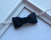 Navy Blue Mini Tuxedo Bow attached to a White Skinny Elastic Headband