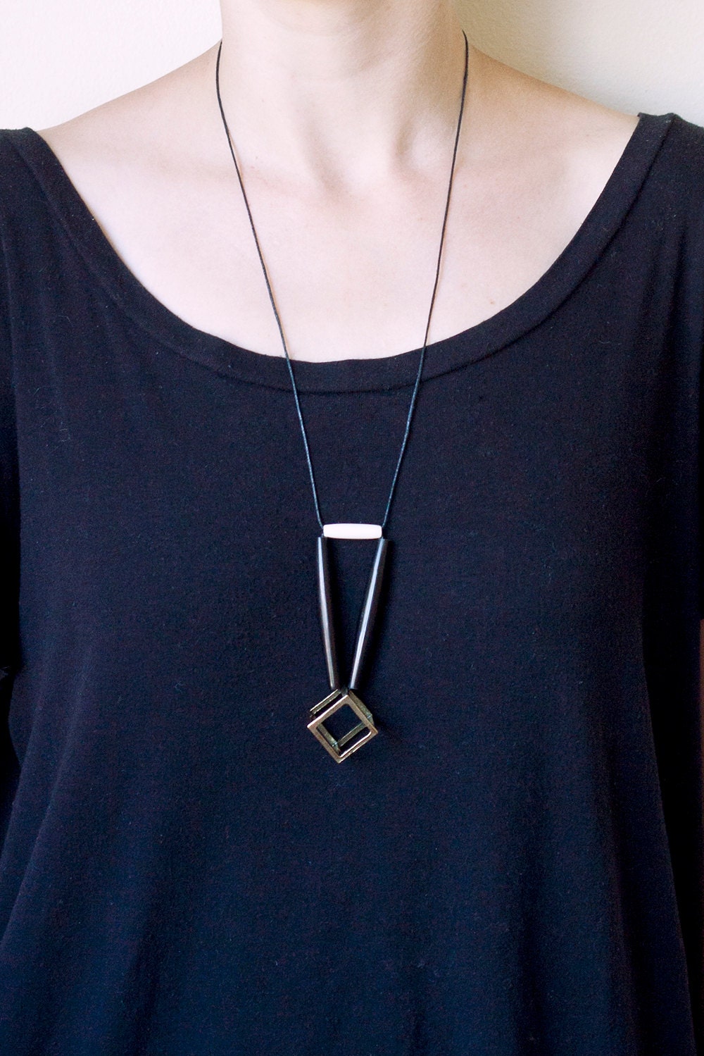 ONE LEFT geometric, tribal, metal cube, long black bone beads, white bone bead and black rope, long, beaded necklace
