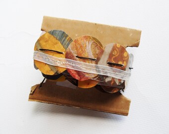 Sewn paper ribbon garland- recycled calendar art of Gustav Klimt. Unique projects for collage, gift wrap, book arts. green and gold.
