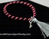 Burgundy colored Pearl Stretch Tassel Bracelet